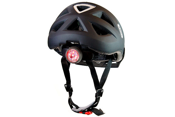 Bicycle helmet with twist lock and integrated light